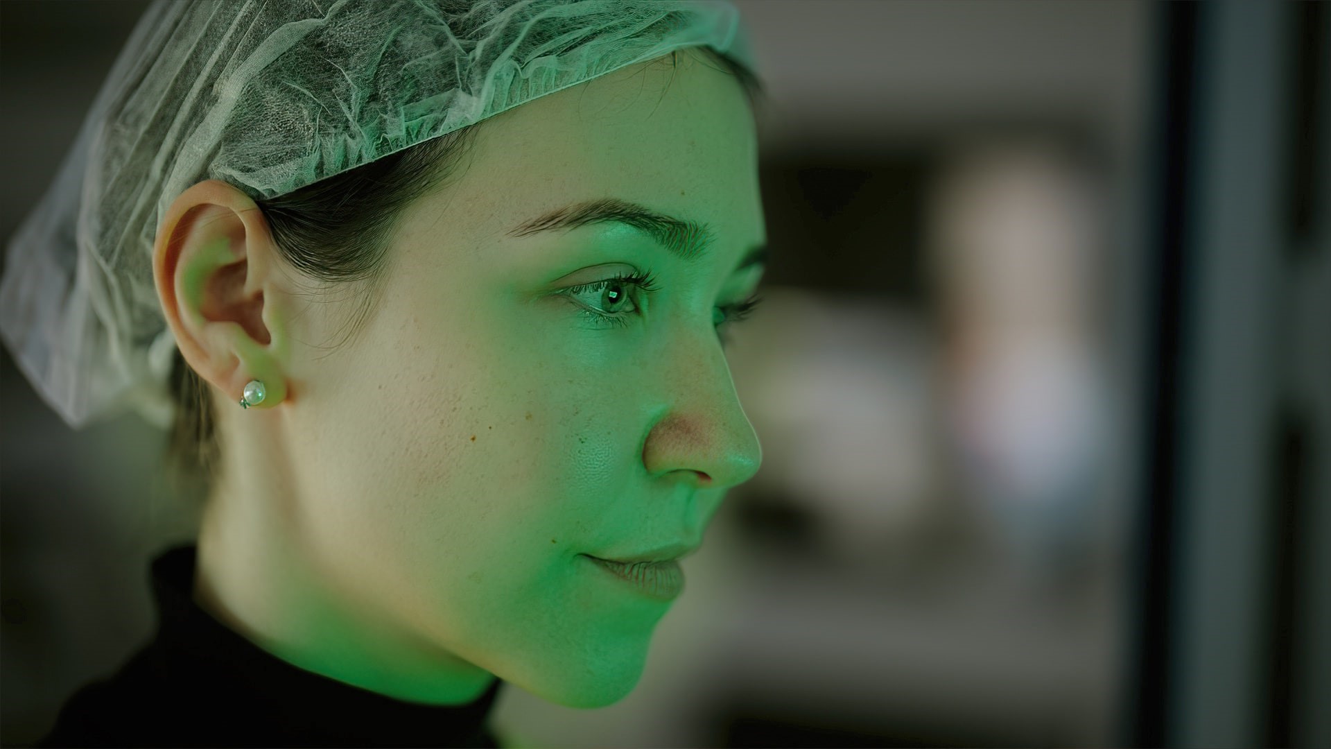 Innovation over Bias, Women in Life Science, Lab worker with green hue on face